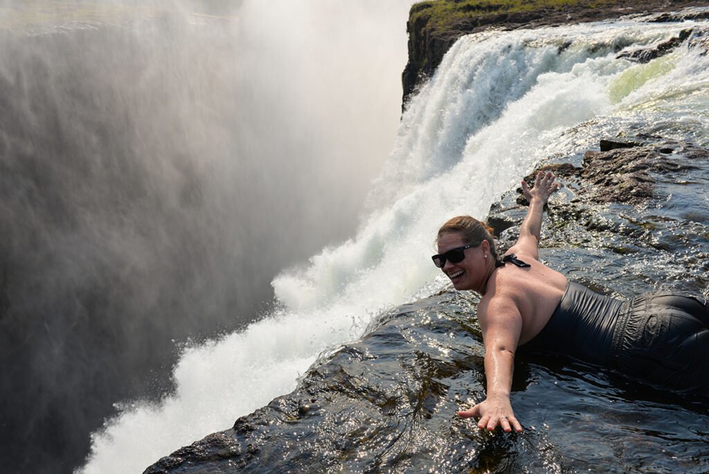 On the edge of Devil's Pool at Victoria Falls | Go2Africa