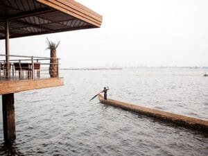 From the banks of the Congo river, watch the boats go by and catch a glimpse of Kinshasa, the capital city of the DRC