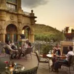 Enjoy rooftop sundowner drinks at The Palace of the Lost City, the most luxurious hotel at the resort.