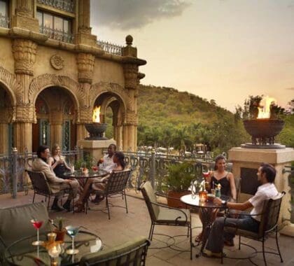 Enjoy rooftop sundowner drinks at The Palace of the Lost City, the most luxurious hotel at the resort.