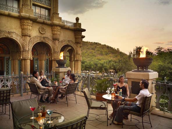 Enjoy rooftop sundowner drinks at The Palace of the Lost City, the most luxurious hotel at the resort.