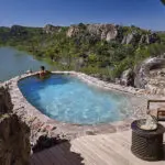 Guests at Singita Pamushana can enjoy a swim with expansive views across the reserve.