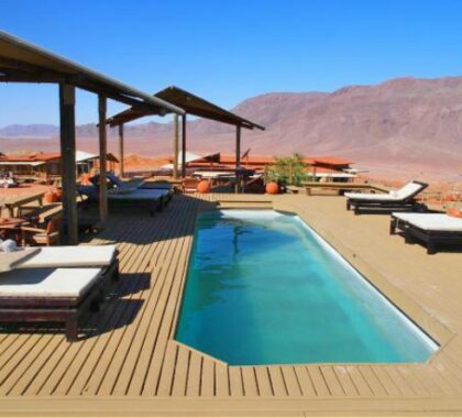 Cool off in the lodge’s swimming pool after a thrilling day of exploring the Namib Desert.