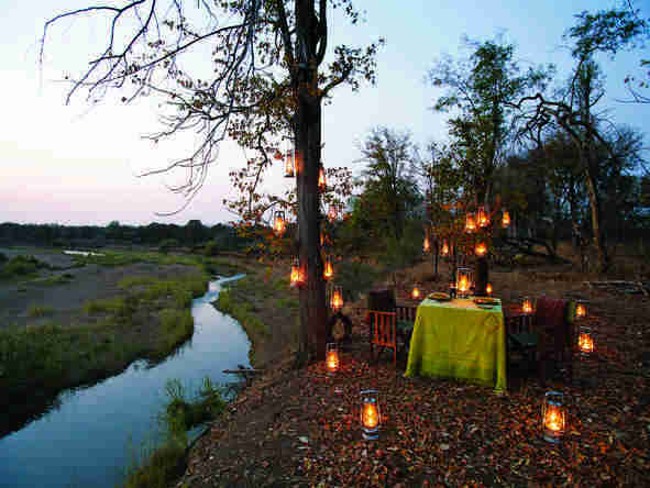 Enjoy a delicious candlelit dinner on the banks of the river.