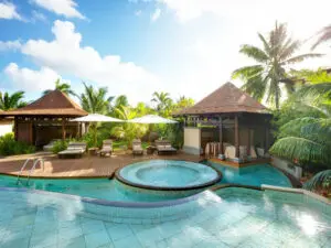 Enjoy a couple's massage in the shade of a poolside gazebo.
