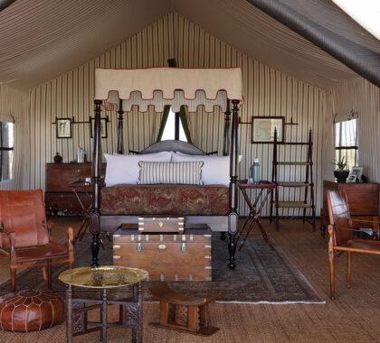 The tents offer enormous four-posters, draped in crisp cotton and feather-soft blankets, raised high above Persian rugs.