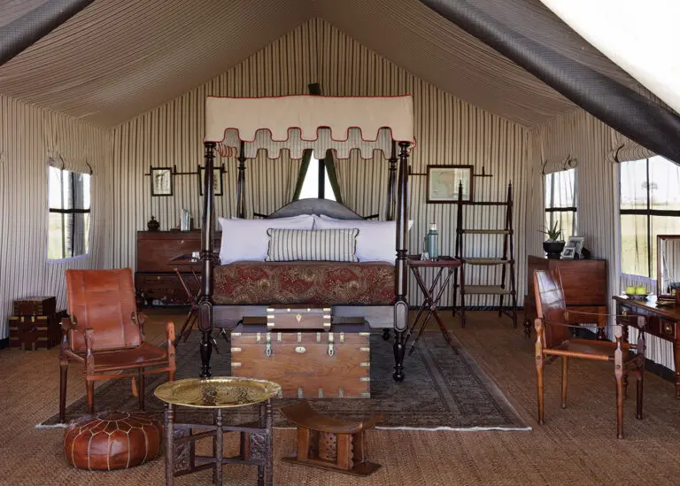 The tents offer enormous four-posters, draped in crisp cotton and feather-soft blankets, raised high above Persian rugs.