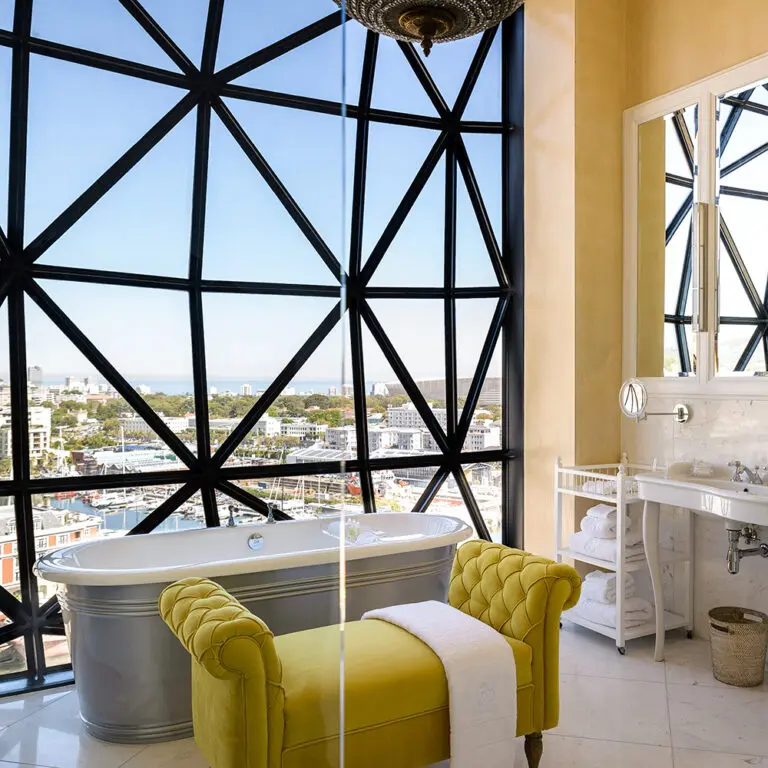 Even the bathrooms boast contemporary art and eclectic, colourful flair. 