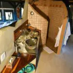 The en suite bathroom has a large shower and two basins.