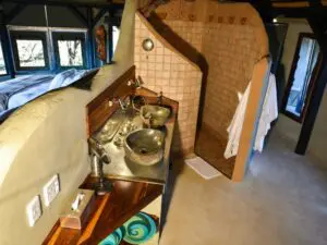 The en suite bathroom has a large shower and two basins.