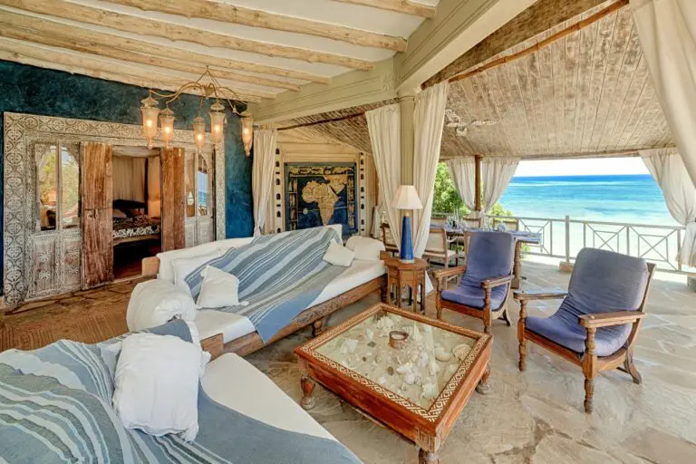 The spacious verandah is furnished with hand-carved sofas that are perfectly positioned to soak up the spectacular ocean views.