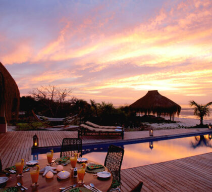 Unwind with a candle-lit dinner & a spectacular sunset after a day on the beach.
