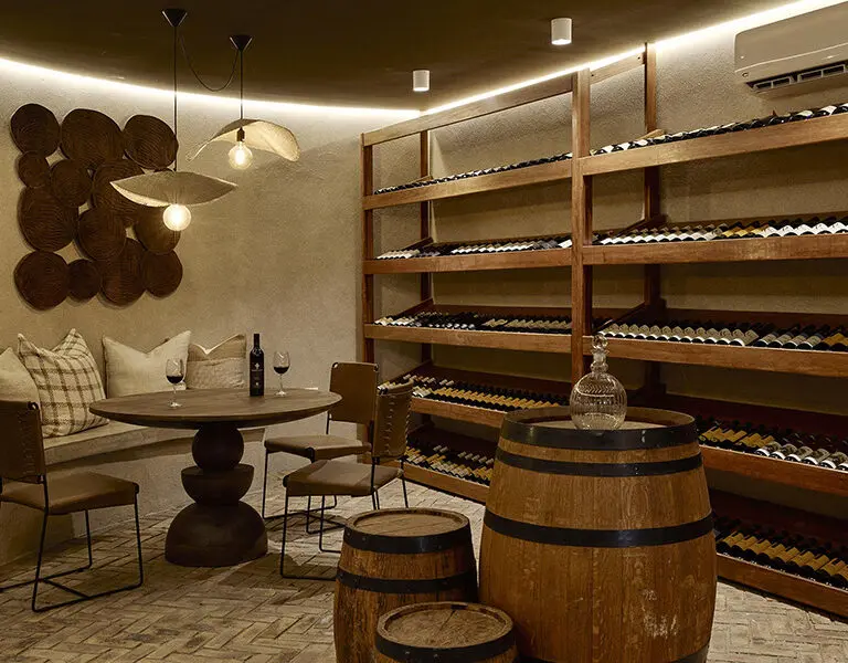 The wine cellar, stocked with fine South African wines ready to pair with your dinner. 