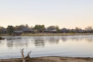 Arathusa Safari Lodge overlooks a large waterhole with resident hippos. 