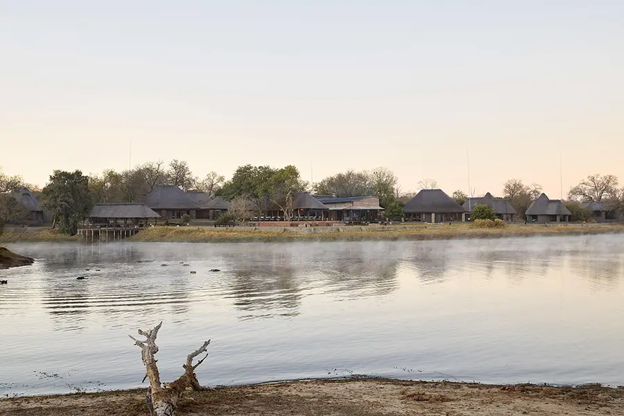 Arathusa Safari Lodge overlooks a large waterhole with resident hippos. 