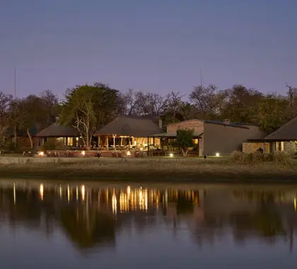 Arathusa Safari Lodge looks out over a large waterhole which attracts an array of wildlife right to the lodge. 