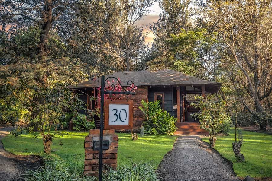 Exterior de la habitación del Arusha Coffee Lodge.