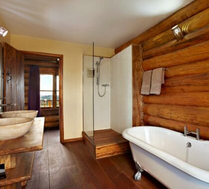 Well-appointed bathrooms have marble vanities, shower and a separate bathtub.
