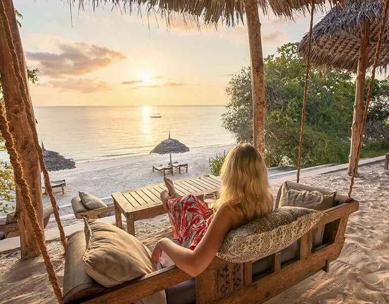Sit back and watch the sun go down at the beach bar. 