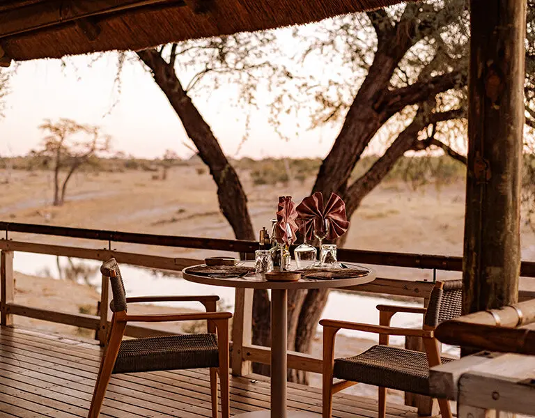 Dine on the observation deck overlooking a waterhole.