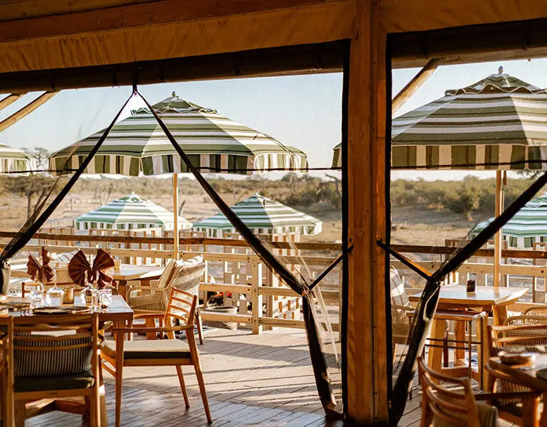 The indoor dining area leads out onto the pool and viewing deck where you can look out over the wilderness and a waterhole. 