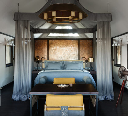 Sleep soundly in your over-sized bed at Belmond Eagle Island Camp.