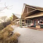 The Family Tent at Meno a Kwena has one double room with an additional room with three twin beds.