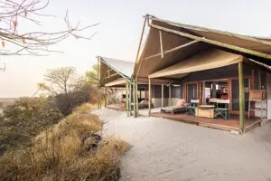 The Family Tent at Meno a Kwena has one double room with an additional room with three twin beds.