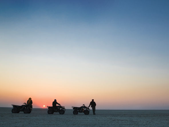 Explore the vast Makgadikgadi Pans by quad bike from the grandeur of Jack's Camp, one of Botswana's most unique destinations.