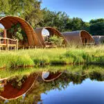 Camp Okuti rooms overlooking a water channel. 