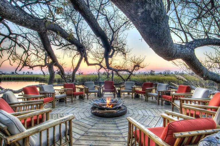 Cosy up to a fire at Camp Xakanaxa's.