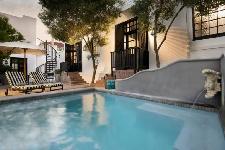 Absorb the sun's warm rays next to the large swimming pool.