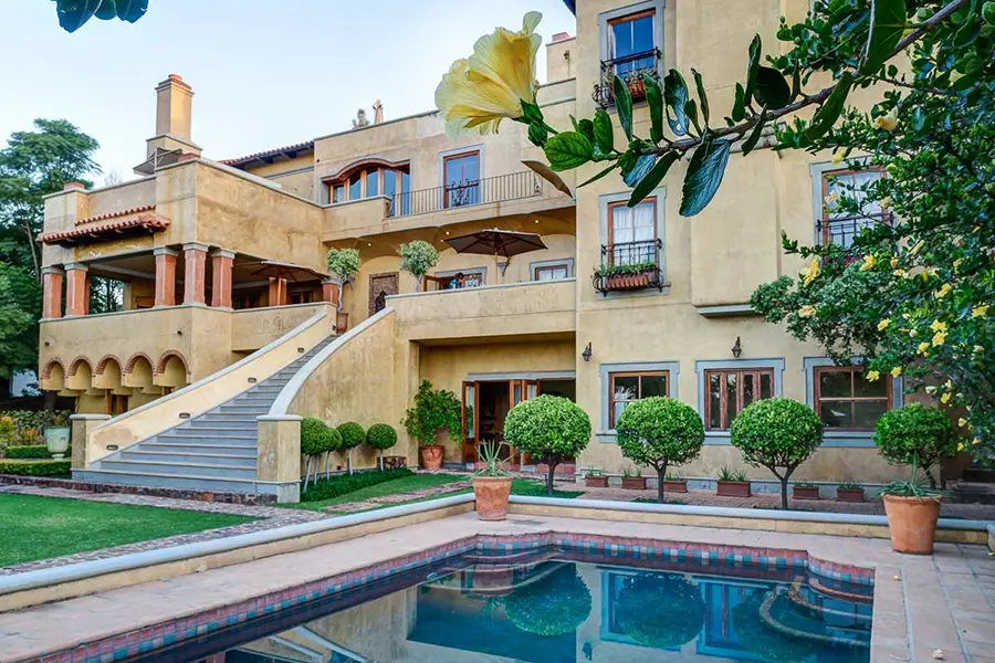  A swimming pool set in a lush garden.