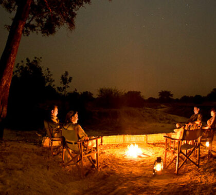 After dinner, draw your chair closer to the fire & absorb the sounds of the African night.