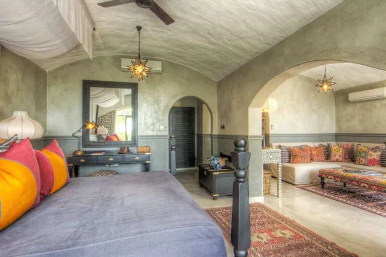 The rooms are furnished with hand-crafted Rhodesian teak.