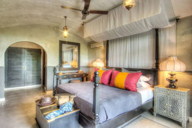 Hand-painted fabric canopies hung above the beds.