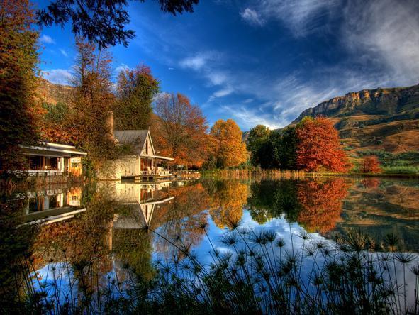 Cleopatra Mountain Farmhouse is settled beautifully on a lake surrounded by mountains.
