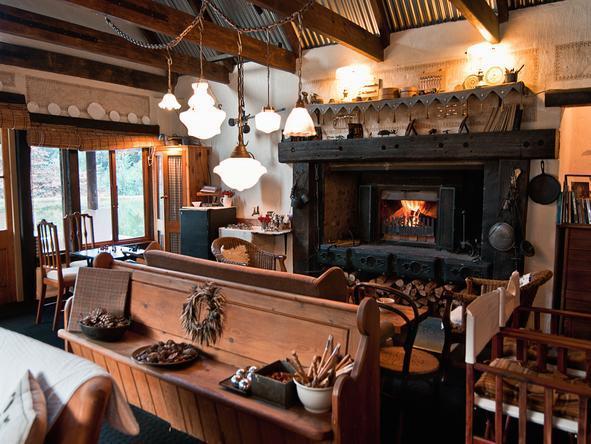 The cozy lounge offers a fireplace for cold evenings.
