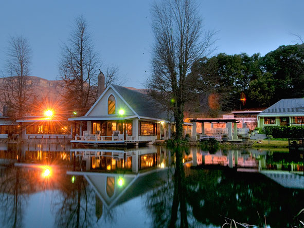 The lodge is situated on a private lake, which looks beautiful when lit up in the evening.
