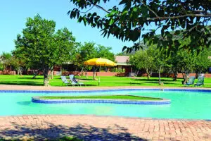 The large swimming pool at the centre of the lodge is the perfect place to cool off after exploring the scenic Damaraland area.