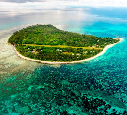 Aerial view of Denis Private Island and the surrounding crystal clear water.