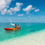 Explore the coastline by kayak.