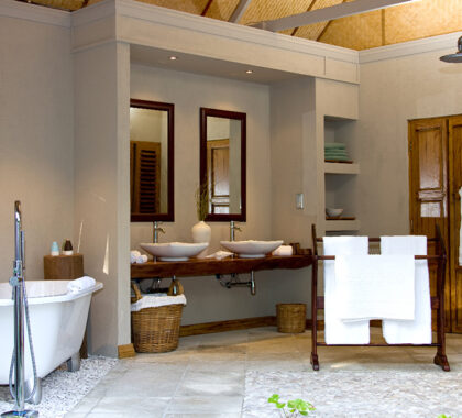 En suite bathroom at Denis Private Island Lodge.