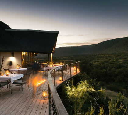 Dine with a view of Kwandwe Private Game Reserve in South Africa.