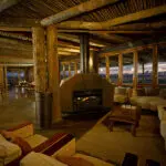Cosy up by the fireplace.