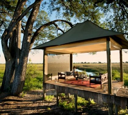 Take in the views of Okavango Delta's floodplains from the daybed | Duba Plains Camp