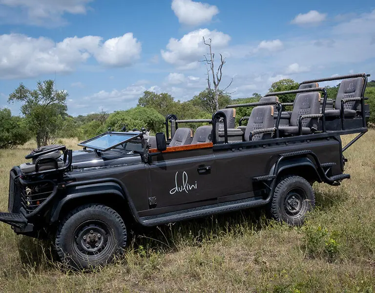 Luxury game viewing vehicles with soft bucket seats. 