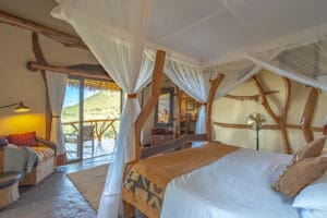 Each bedroom features eclectic style and decor, including hand-crafted wooden beds.
