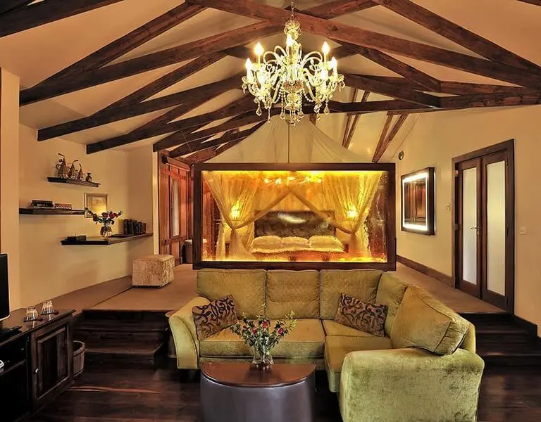 The elegant Plantation Suite interior complete with a lounge and cozy fireplace.