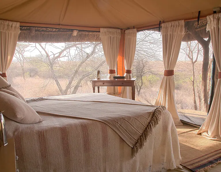 A luxury bedroom offers a stunning view.
